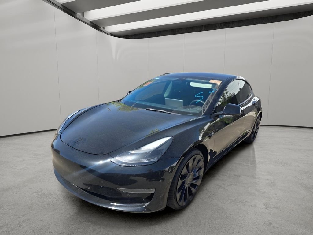 Used 2022 Solid Black Tesla Performance image 2