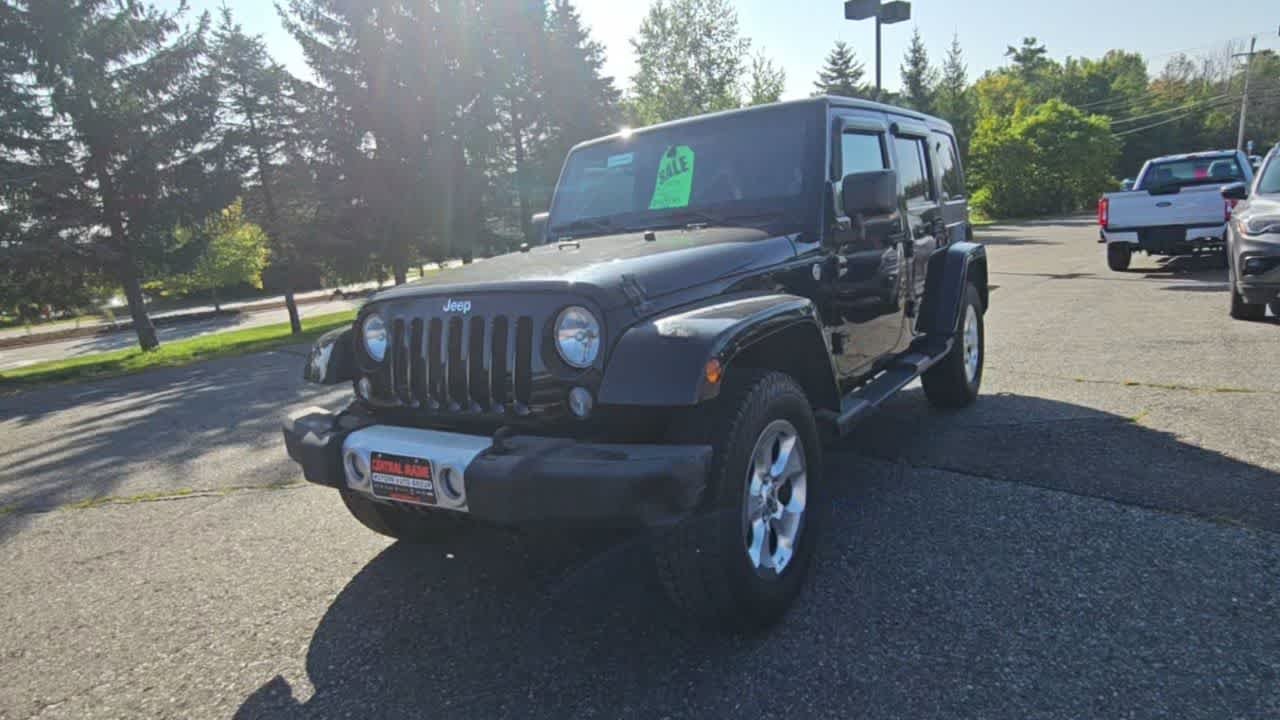 Used 2014 Black Clear Coat Jeep Sahara image 3