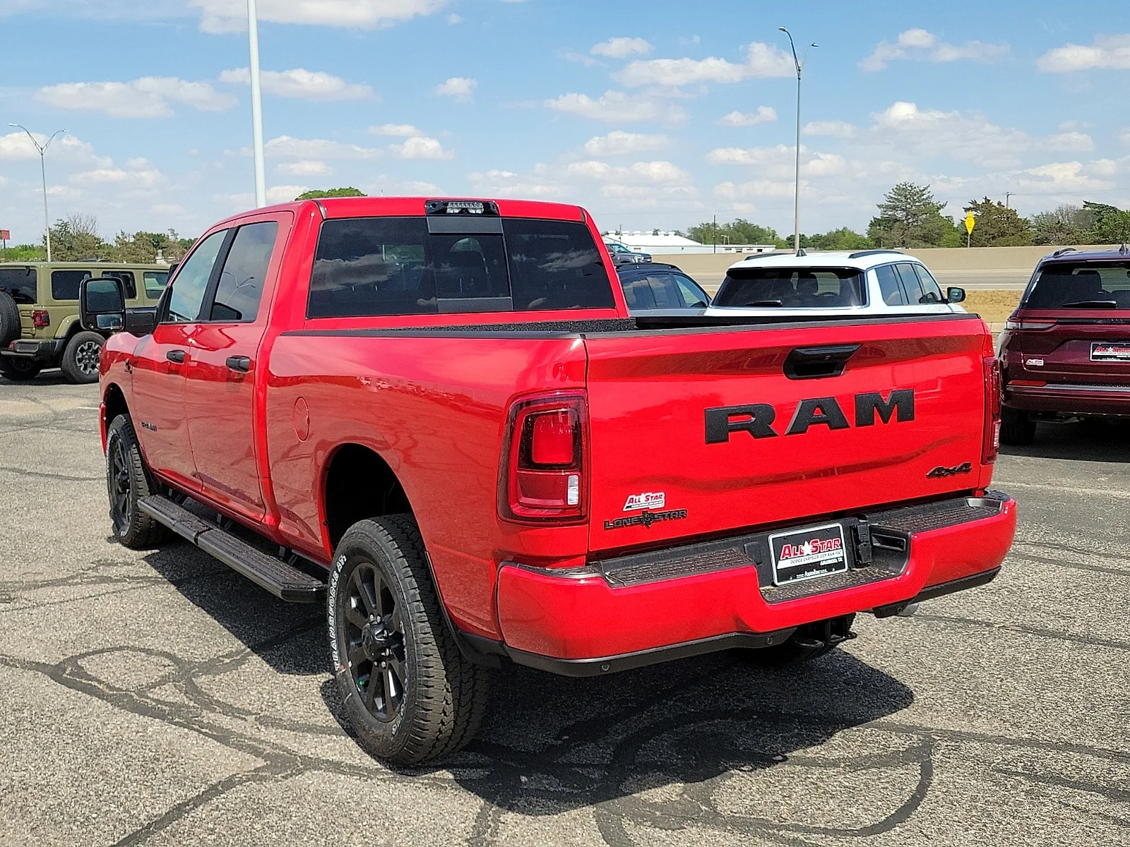 New 2026 Flame Red Ram LONE STAR CREW CAB 4X4 6