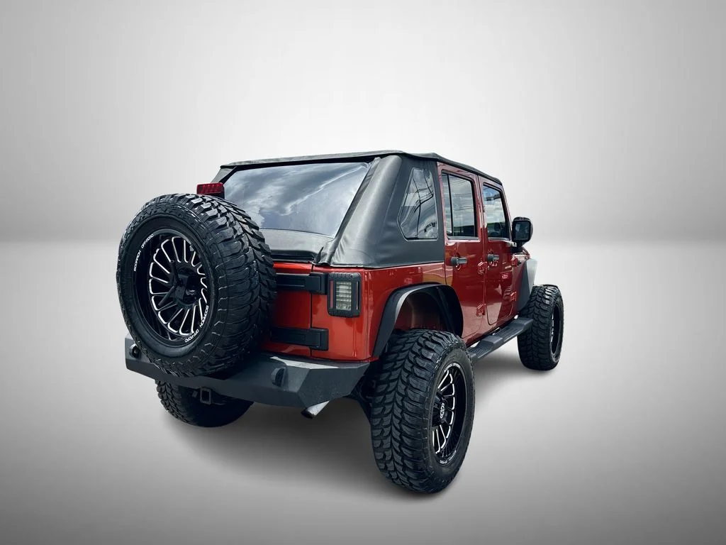Used 2009 Orange Jeep Unlimited X image 4