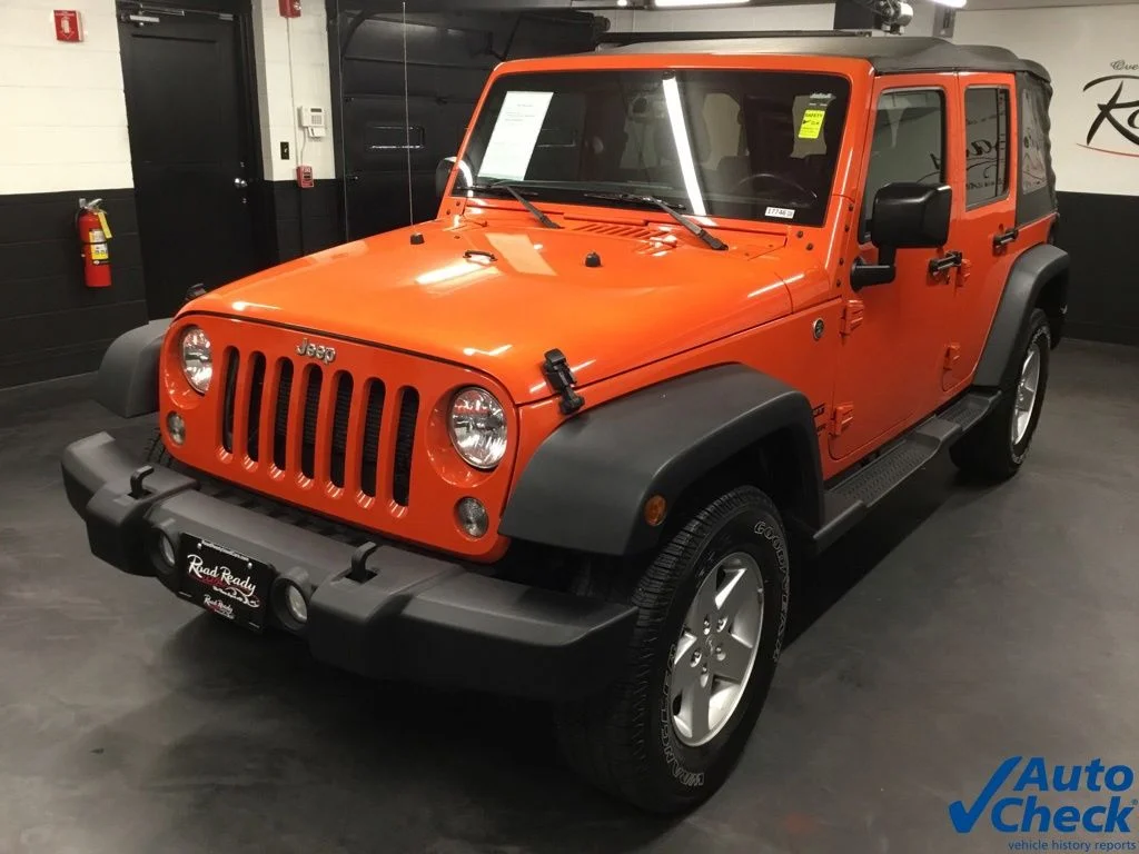 Used 2015 Orange Jeep Unlimited Sport image 6