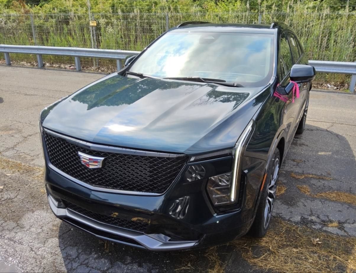 Used 2025 Emerald Lake Metallic Cadillac Sport image 1