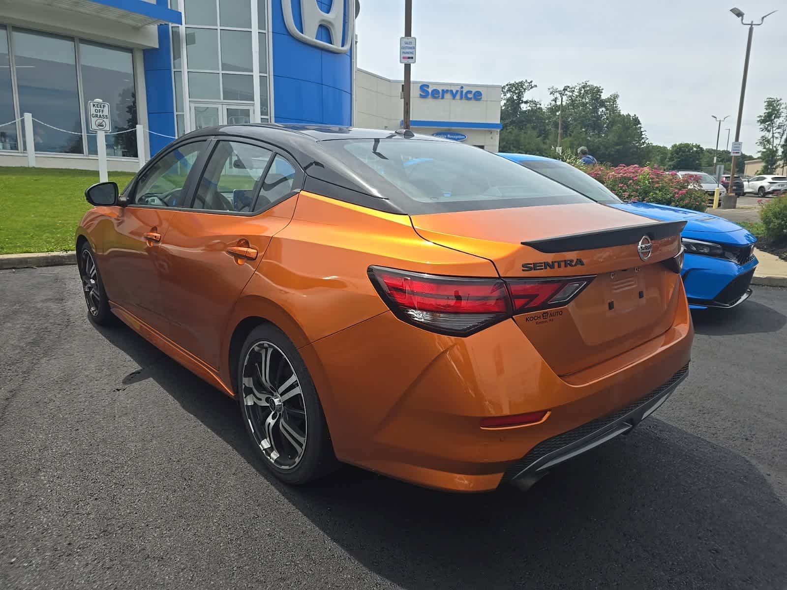 Used 2023 Monarch Orange Metallic/Super Black Nissan SR image 6