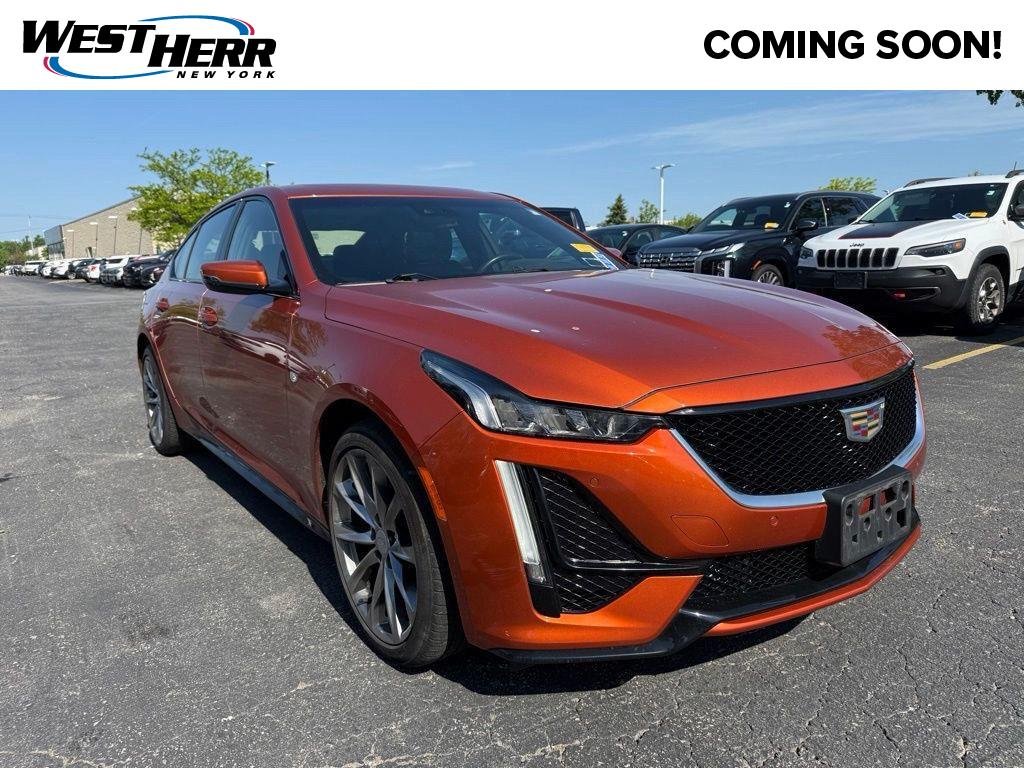 Used 2023 Blaze Orange Metallic Cadillac Sport image 1