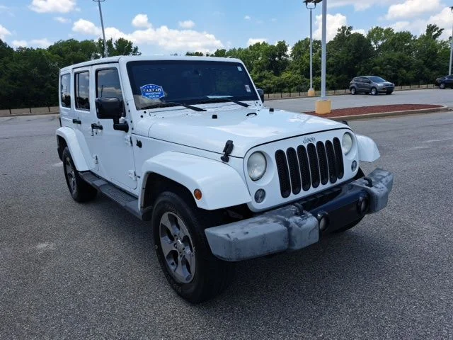 Used 2014 White Jeep Unlimited Sahara image 1
