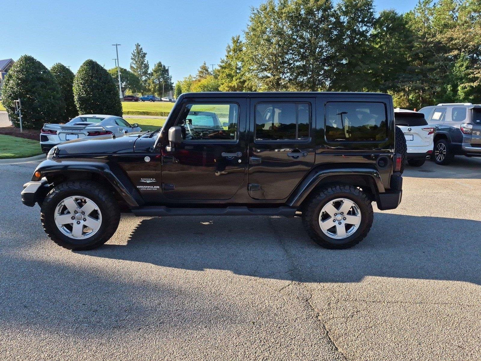 Used 2011 Black Clear Coat Jeep Sahara image 2