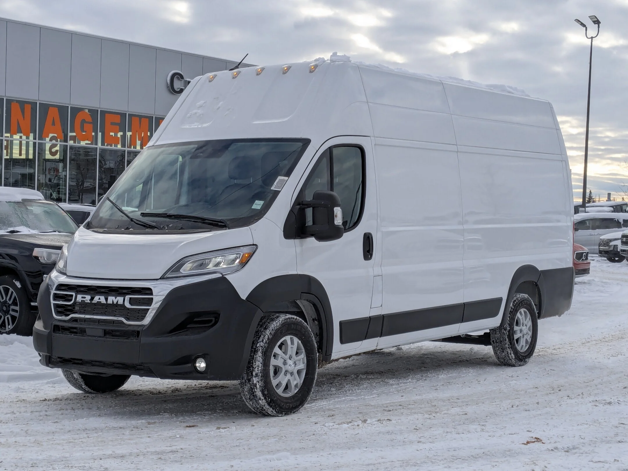 New 2026 White RAM SLT - - FWD - Super High Roof - Package 22G - LED Headlamps - Cargo Partition & More! image 4