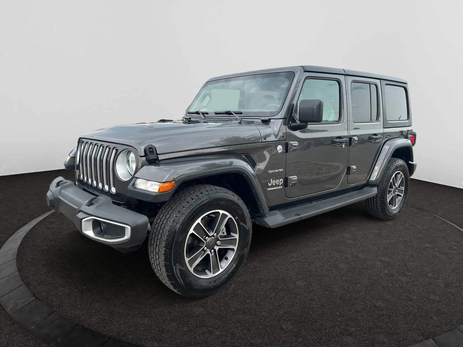 Used 2023 Granite Crystal Metallic Jeep SAHARA image 1