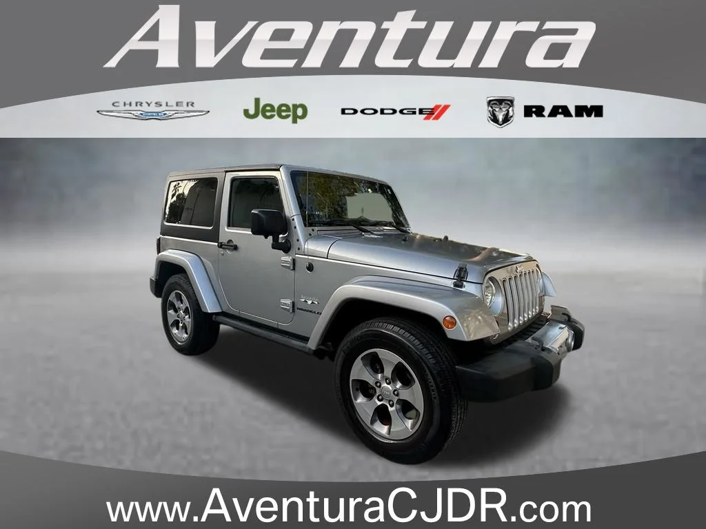 Used 2016 Silver Jeep Sahara image 1