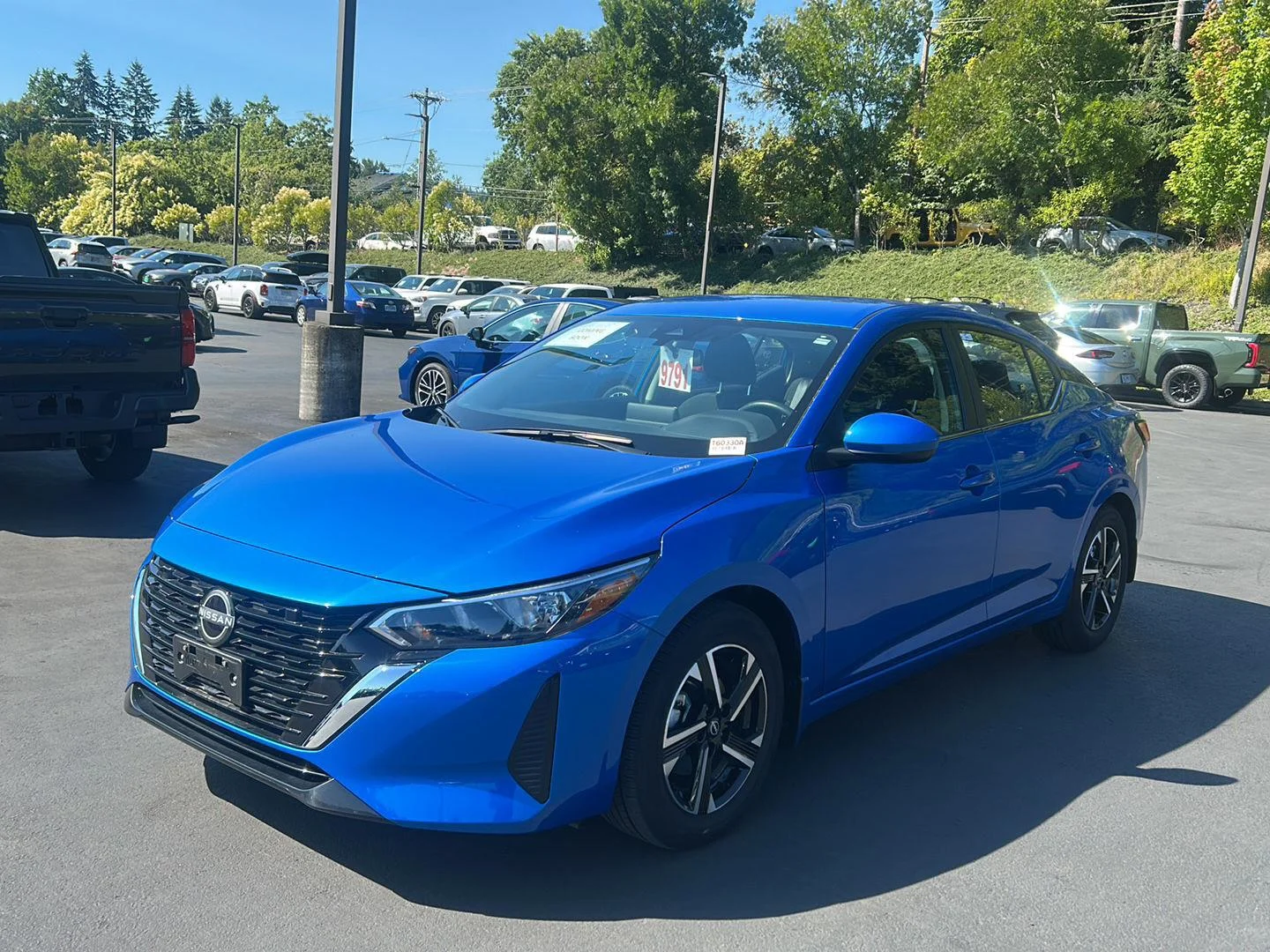 Used 2024 Electric Blue Metallic Nissan SV image 1
