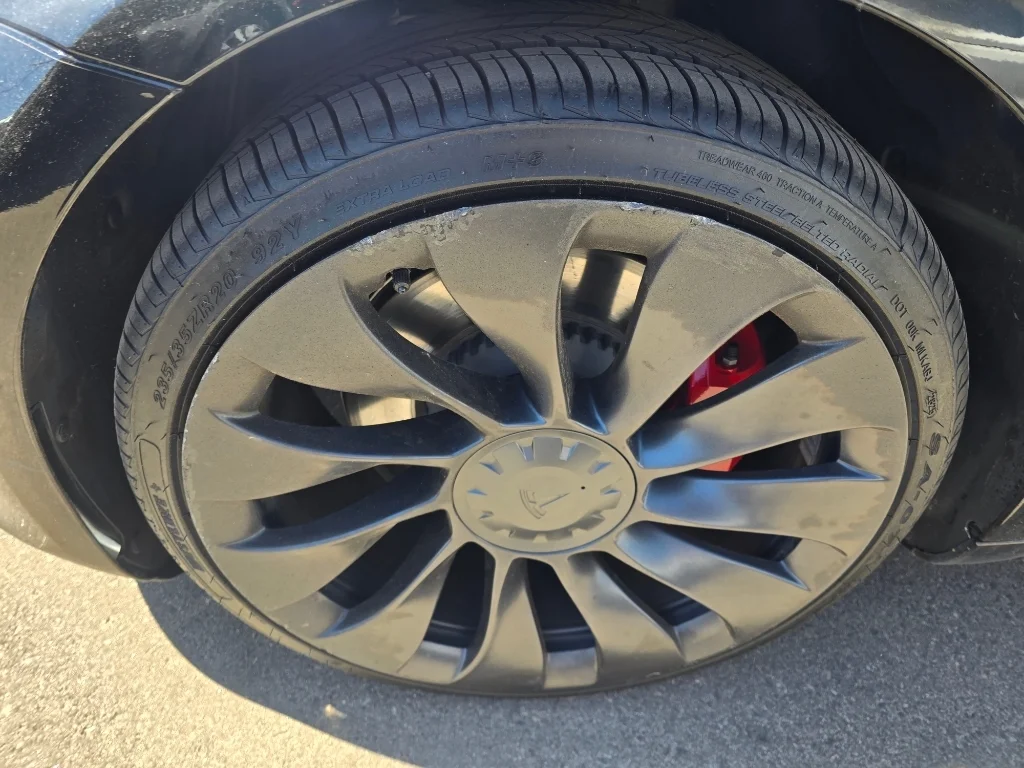 Used 2022 Solid Black Tesla Performance image 9
