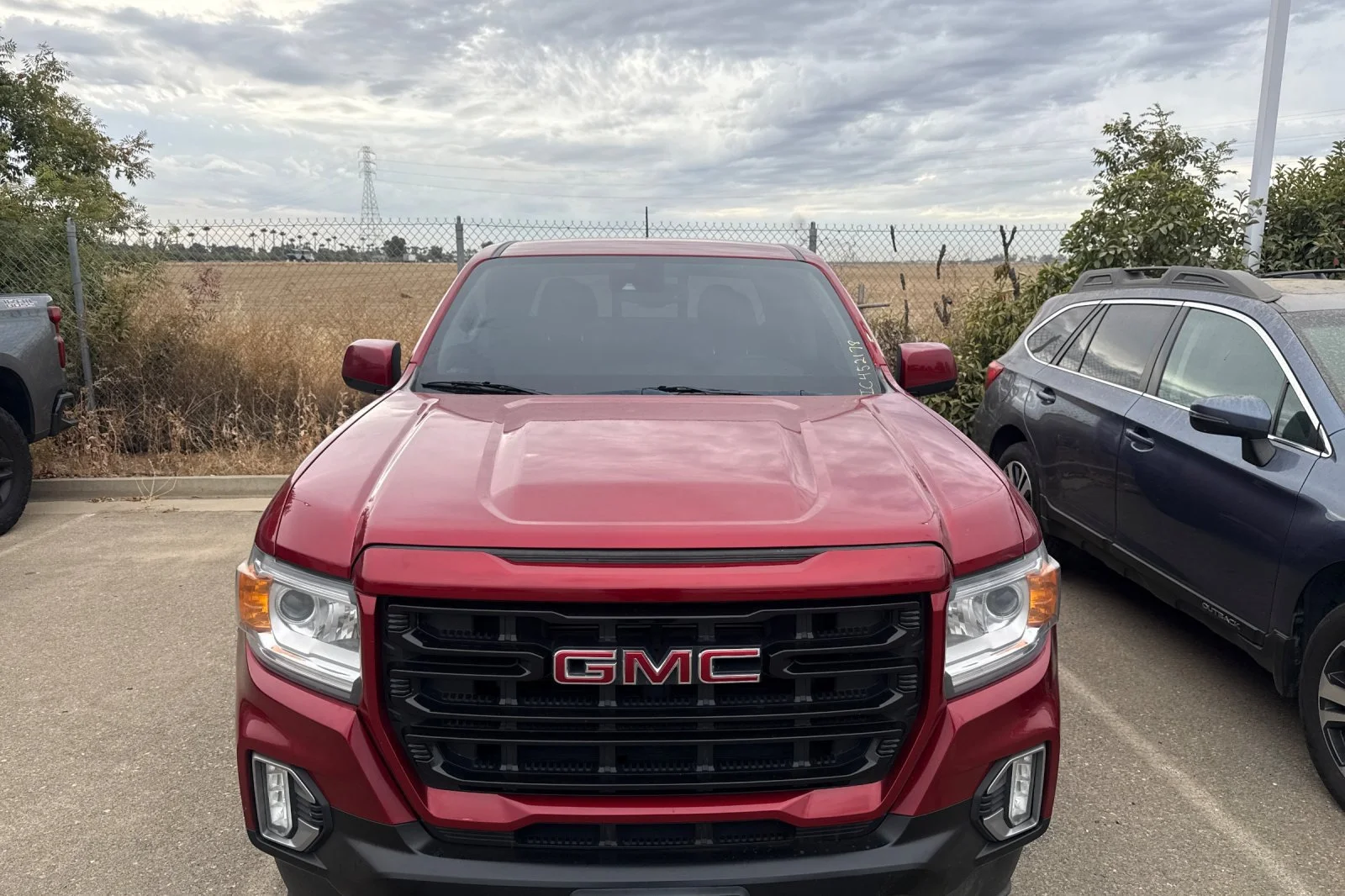 Used 2021 CAYENNE RED TINTCOAT GMC 2WD Elevation image 6