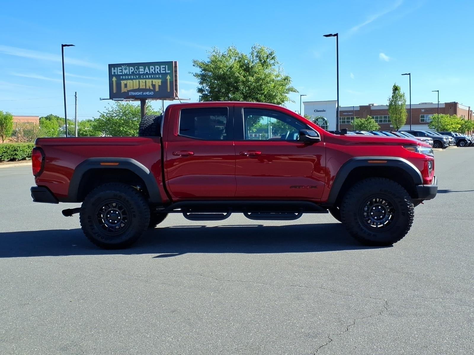 Used 2024 Volcanic Red Tintcoat GMC 4WD AT4X image 11