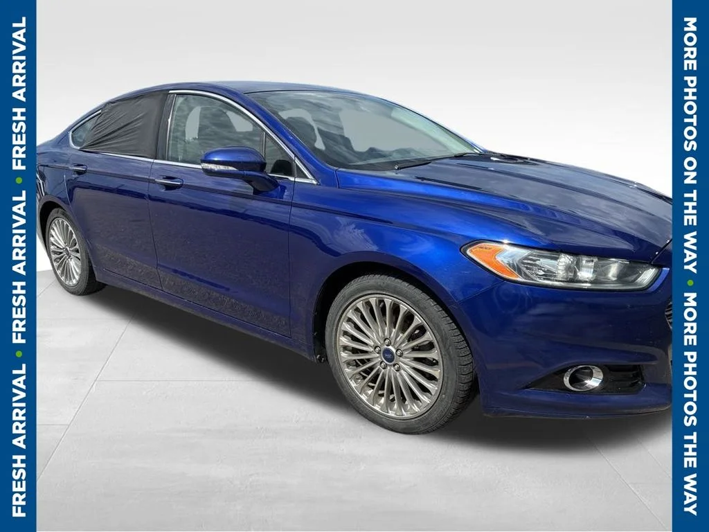 Used 2014 Blue Ford Titanium image 1