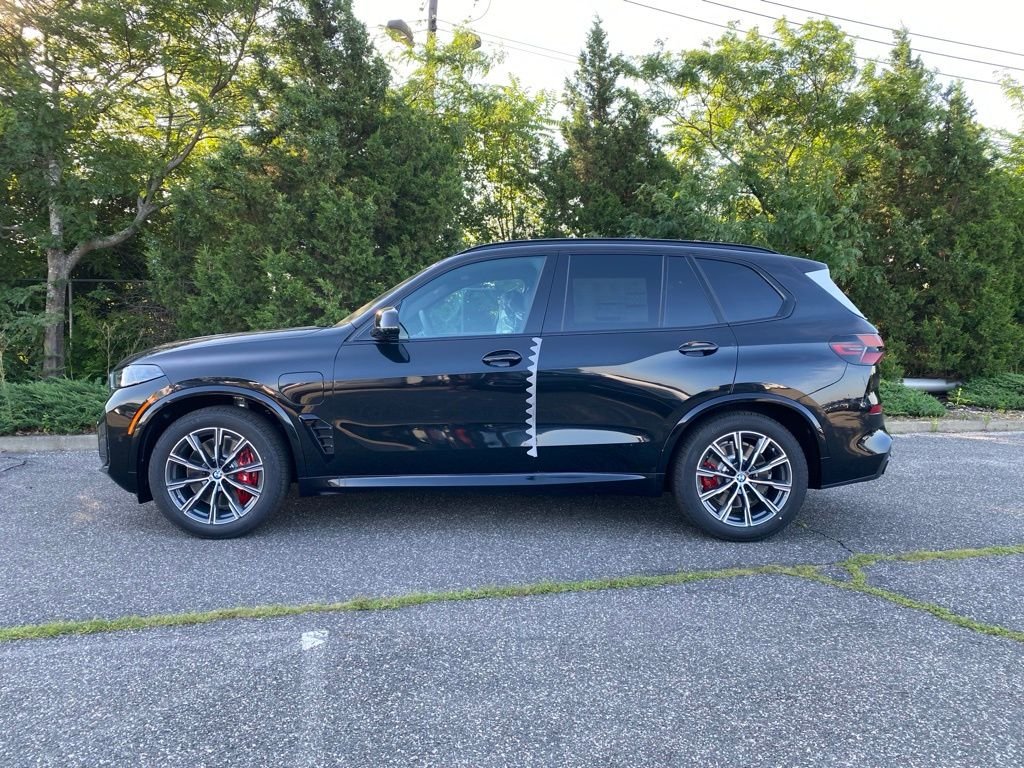 New 2026 Black Sapphire Metallic BMW xDrive50e image 4