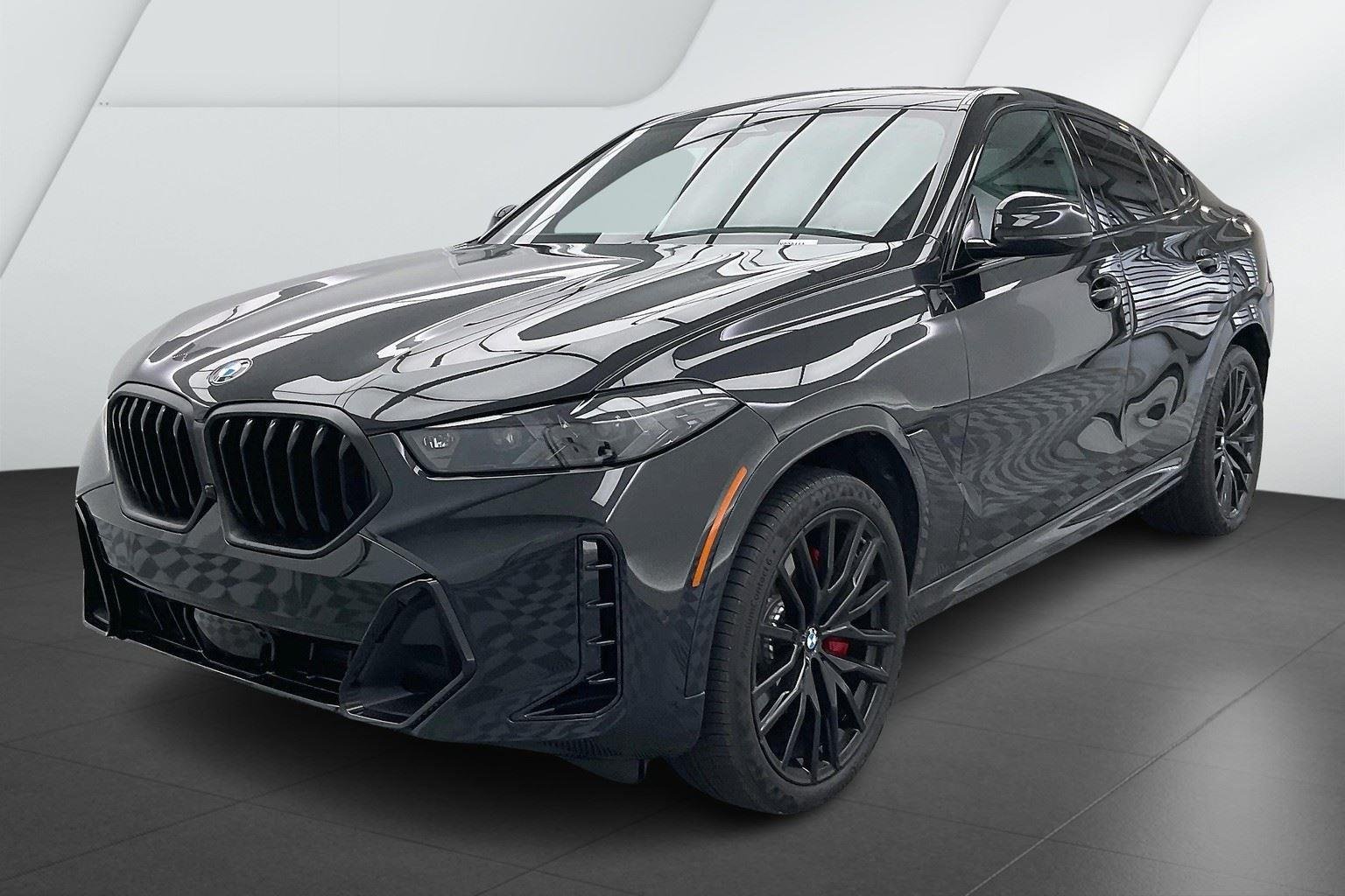 Certified Used 2025 Black Sapphire Metallic BMW xDrive40i image 1