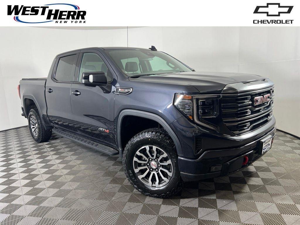 Used 2023 Titanium GMC AT4 image 1