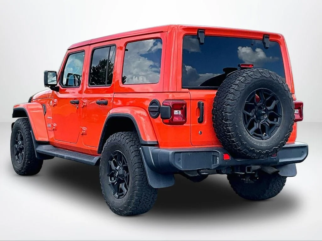 Used 2018 Orange Jeep Unlimited Sahara image 13