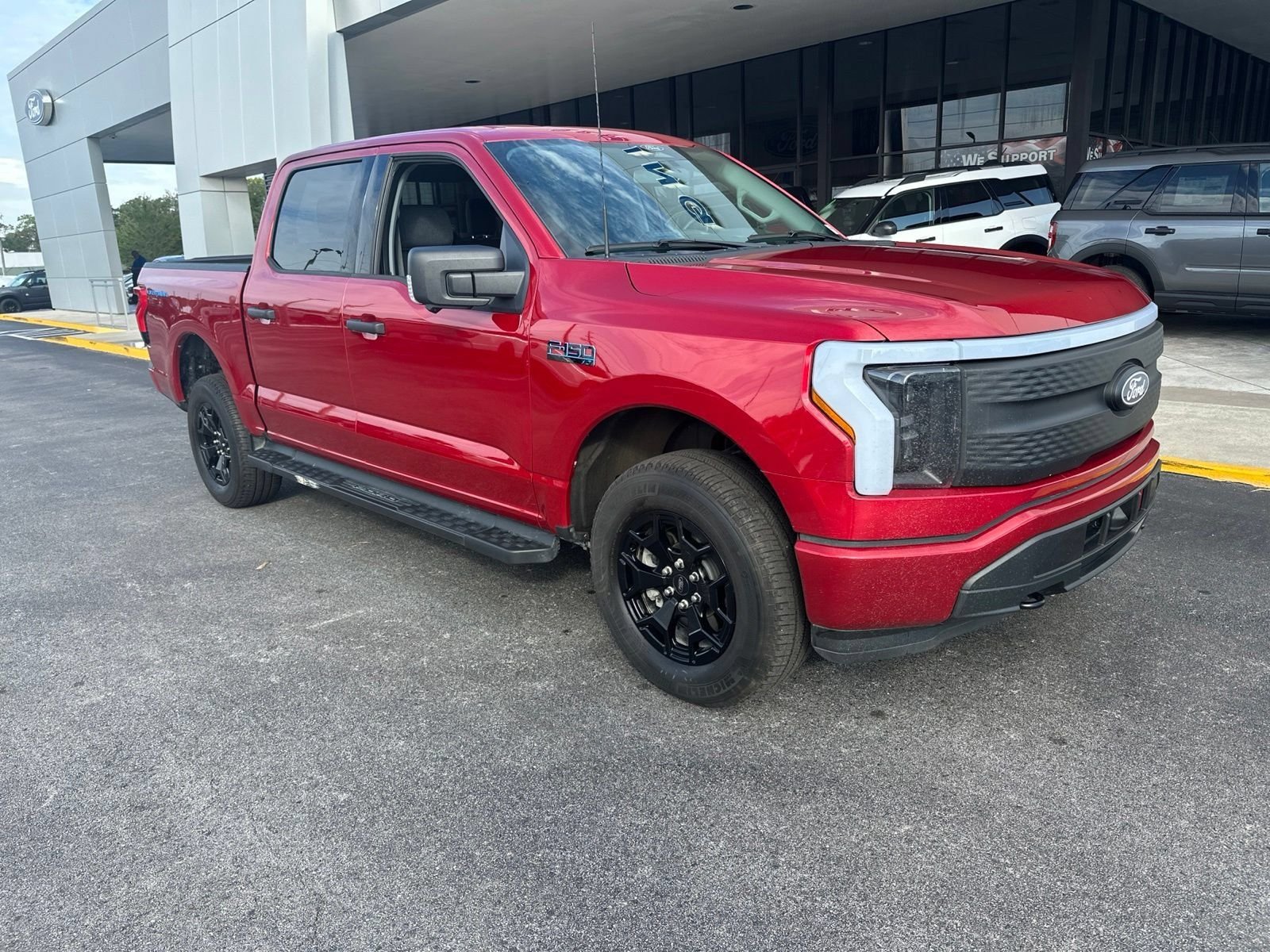 Certified 2025 Ford F-150 Lightning XLT with VIN 1FTVW3LK0SWG05848 for sale in Spring Hill, FL