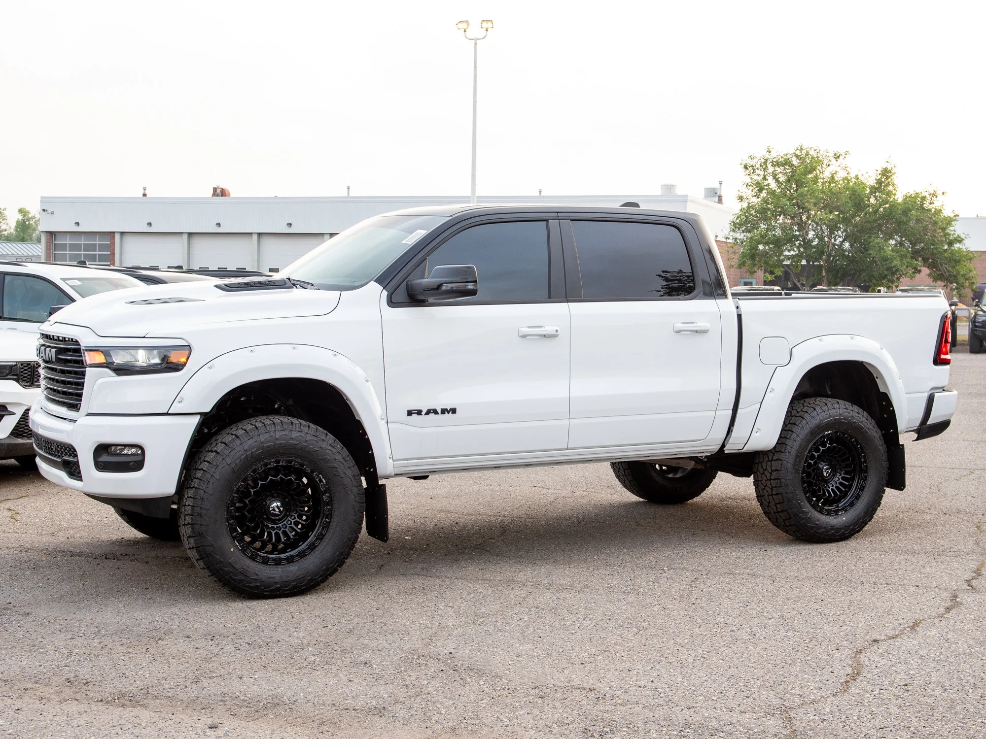 New 2026 White RAM Sport*, 6 Inch Lift, 37 Inch Tires, Trigger Industries Mudflaps image 4