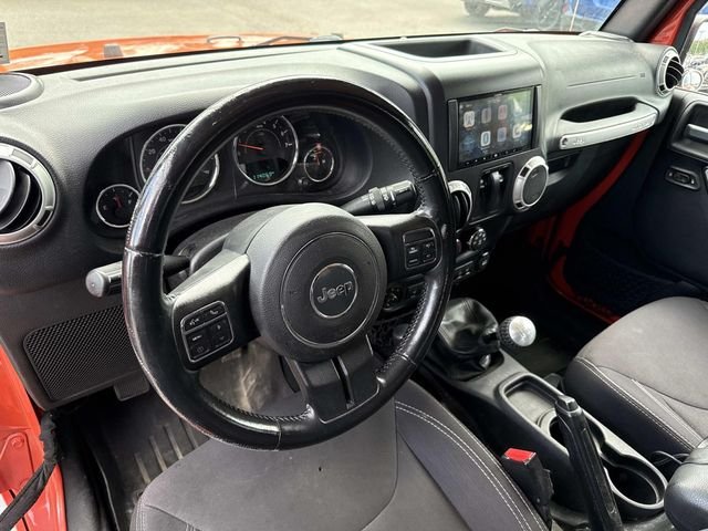 Used 2015 Orange Jeep Sahara image 2