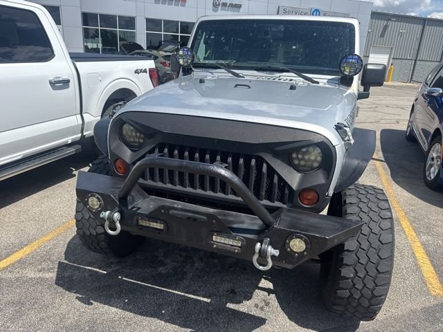 Used 2011 Silver Jeep Unlimited Sport image 2