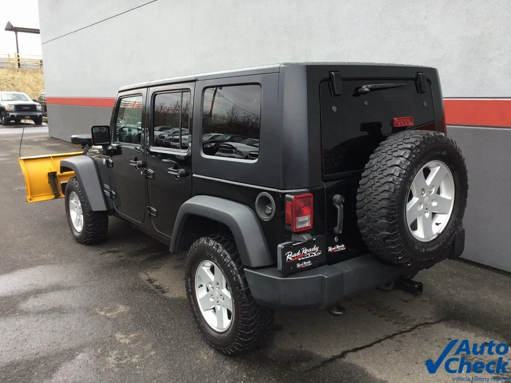 Used 2010 Black Jeep Unlimited Sport image 7