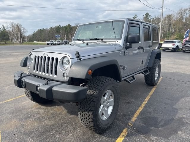 Used 2015 Jeep Wrangler Unlimited Sport with VIN 1C4BJWDG0FL654343 for sale in Manistee, MI