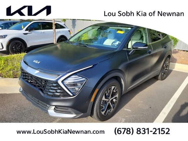 Used 2024 Ebony Black Kia EX image 1