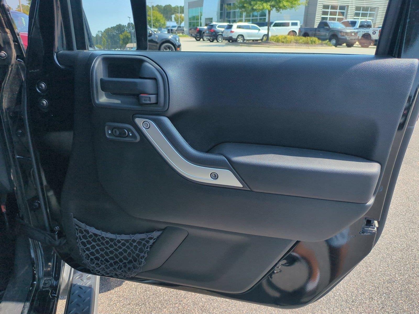 Used 2012 Black Clearcoat Jeep Sahara image 31