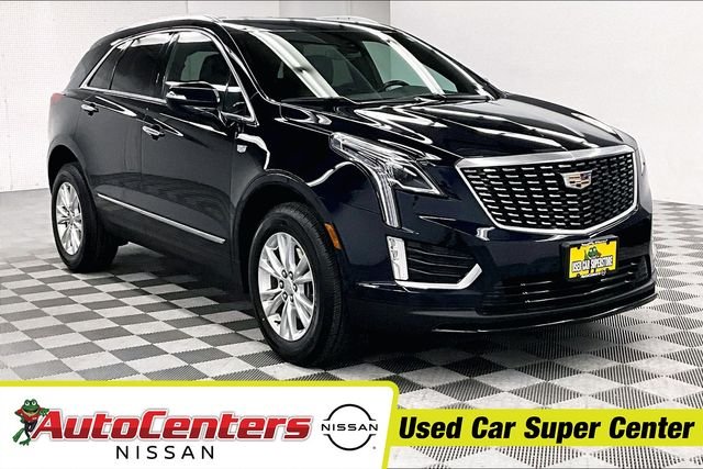 Used 2022 Dark Moon Blue Metallic Cadillac Luxury image 1