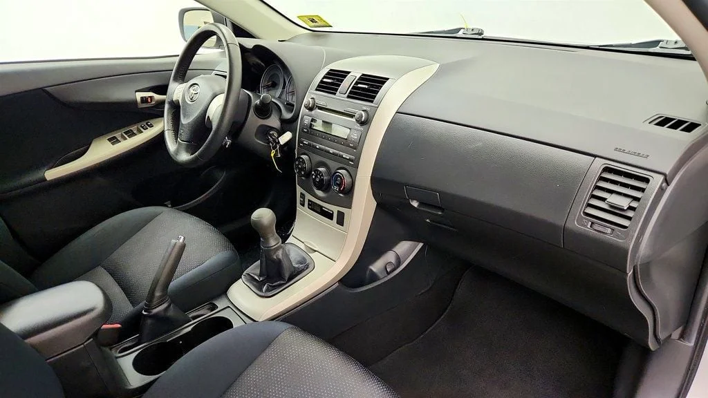 Used 2010 Classic Silver Metallic Toyota 4dr Sedan Manual S w/ Power Moonroof & 16