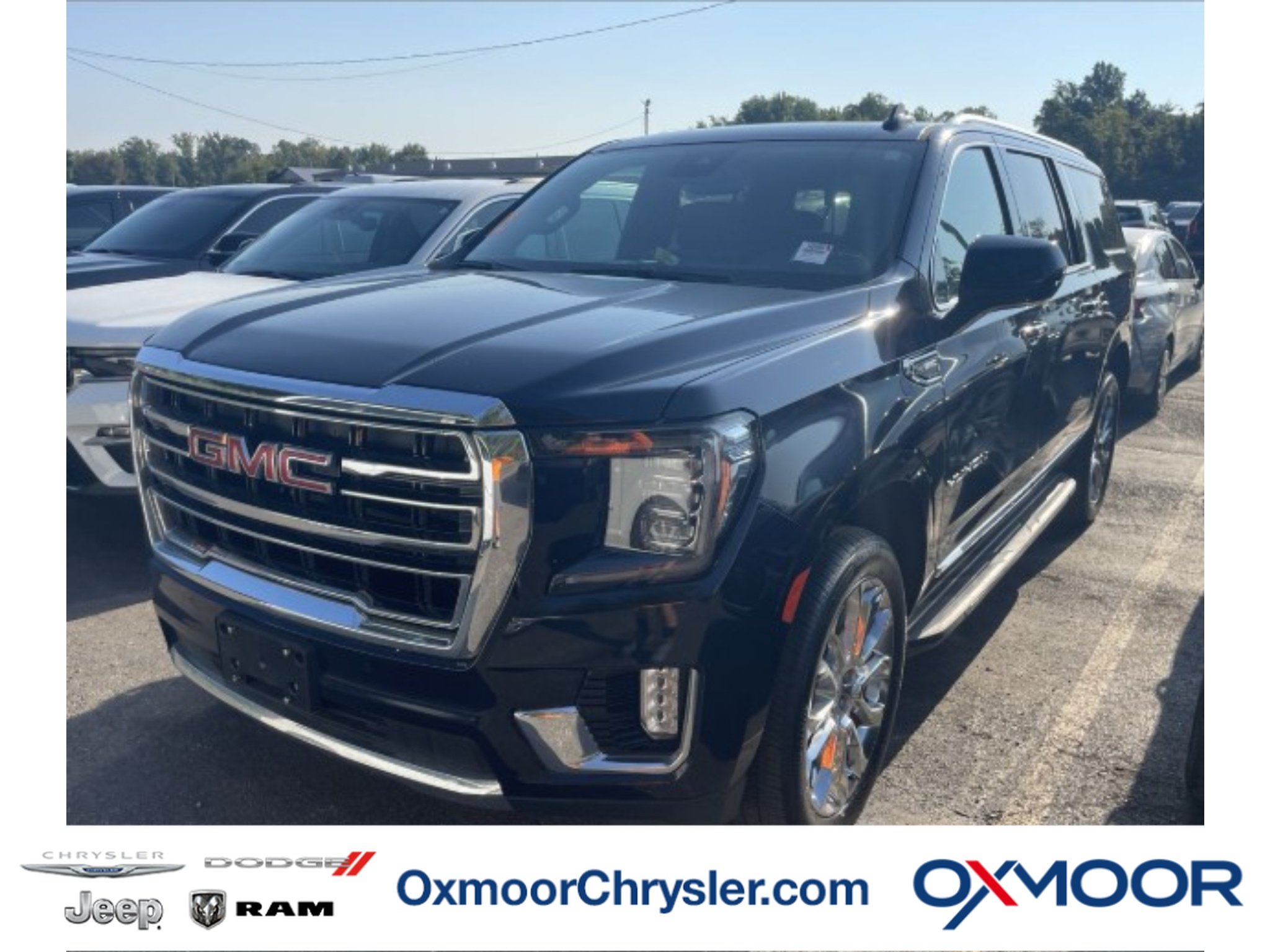 Used 2023 Midnight Blue Metallic GMC SLT image 1