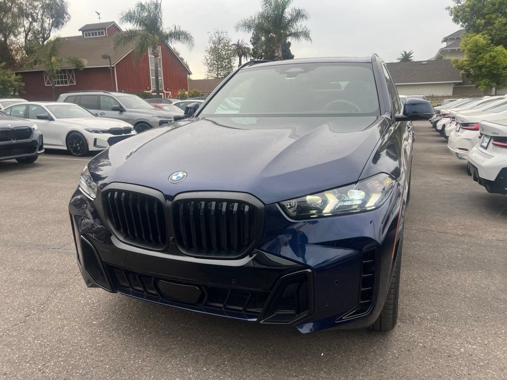 Used 2024 Tanzanite Blue II Metallic BMW sDrive40i image 2