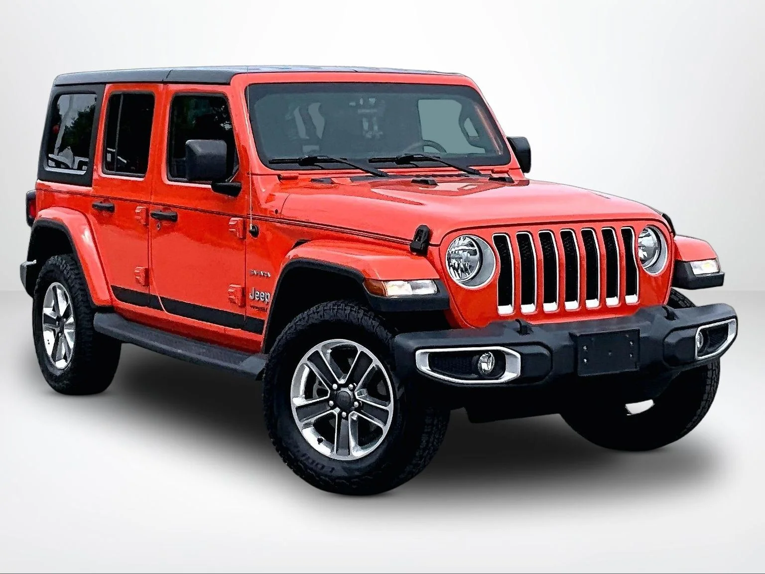 Used 2018 Orange Jeep Unlimited Sahara image 13