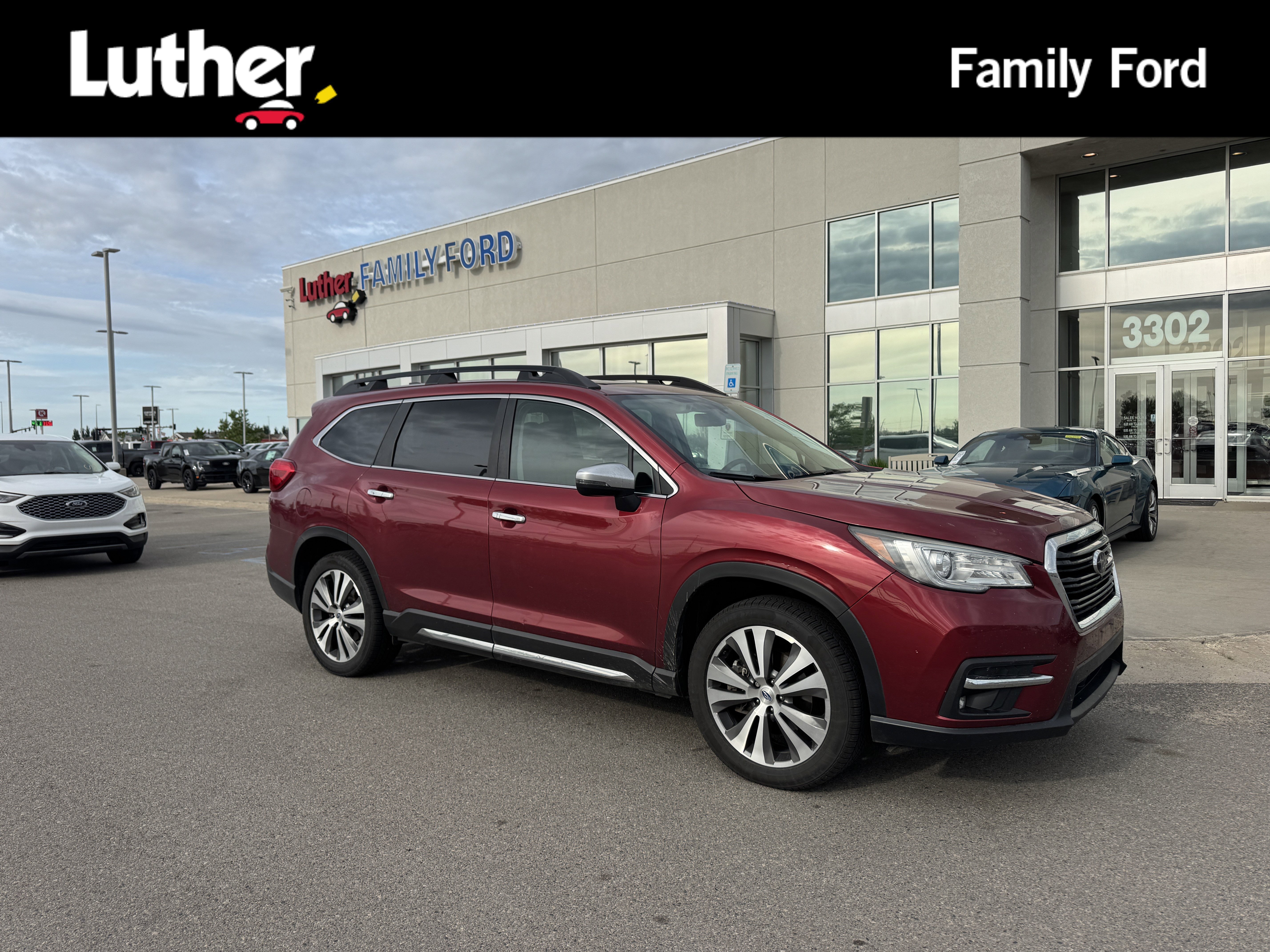 Used 2019 Crimson Red Pearl Subaru Touring image 1