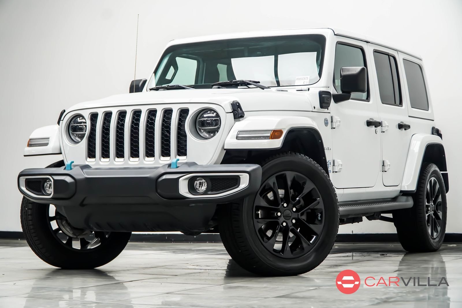 Used 2021 White Jeep Unlimited Sahara 4xe image 1