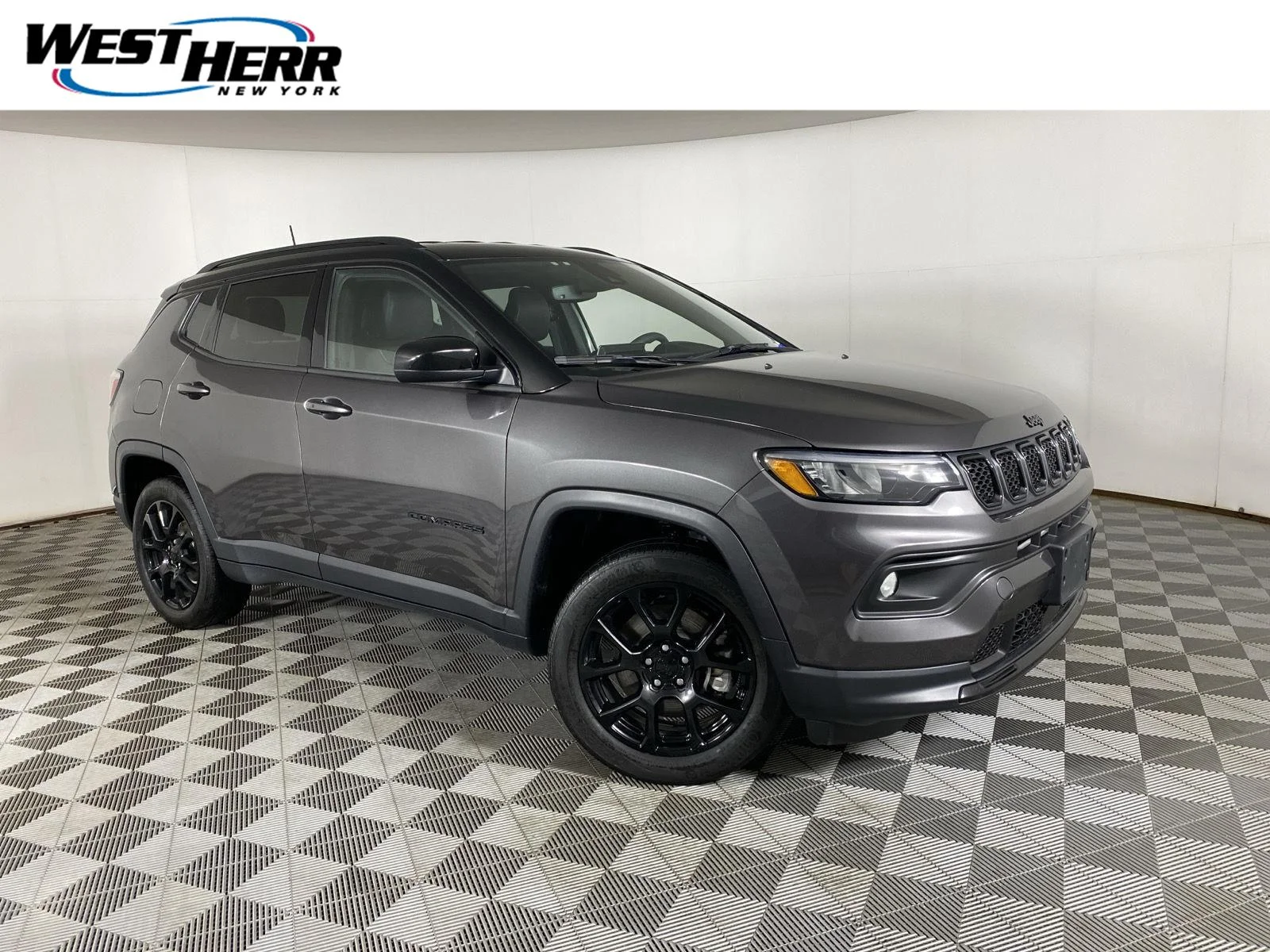 Used 2023 Granite Crystal Metallic Clearcoat Jeep Altitude image 1