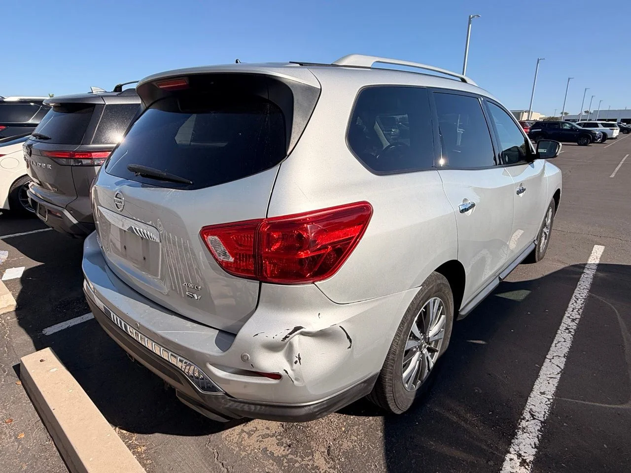 Used 2018 Brilliant Silver Metallic Nissan SV image 4