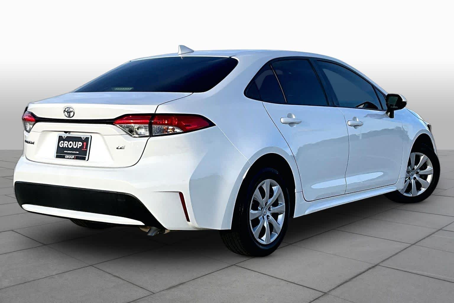 Used 2021 Super White Toyota LE image 13