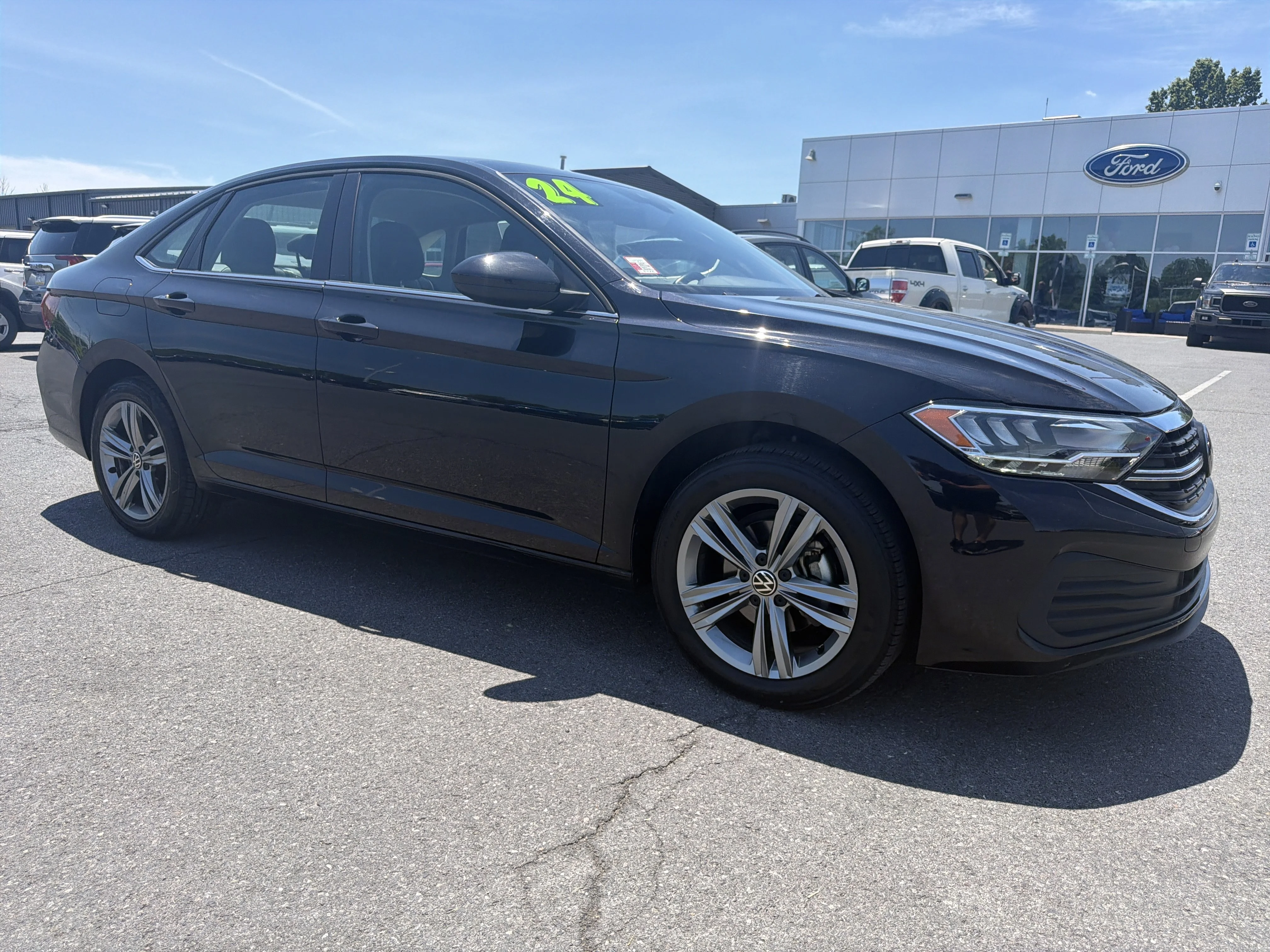 Used 2024 Black Volkswagen SE image 1