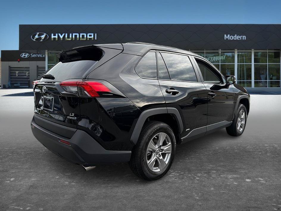 Used 2023 Midnight Black Metallic Toyota Hybrid LE image 4
