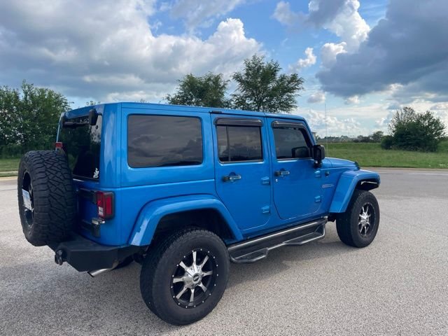 Used 2015 Blue Jeep Unlimited Sahara image 3