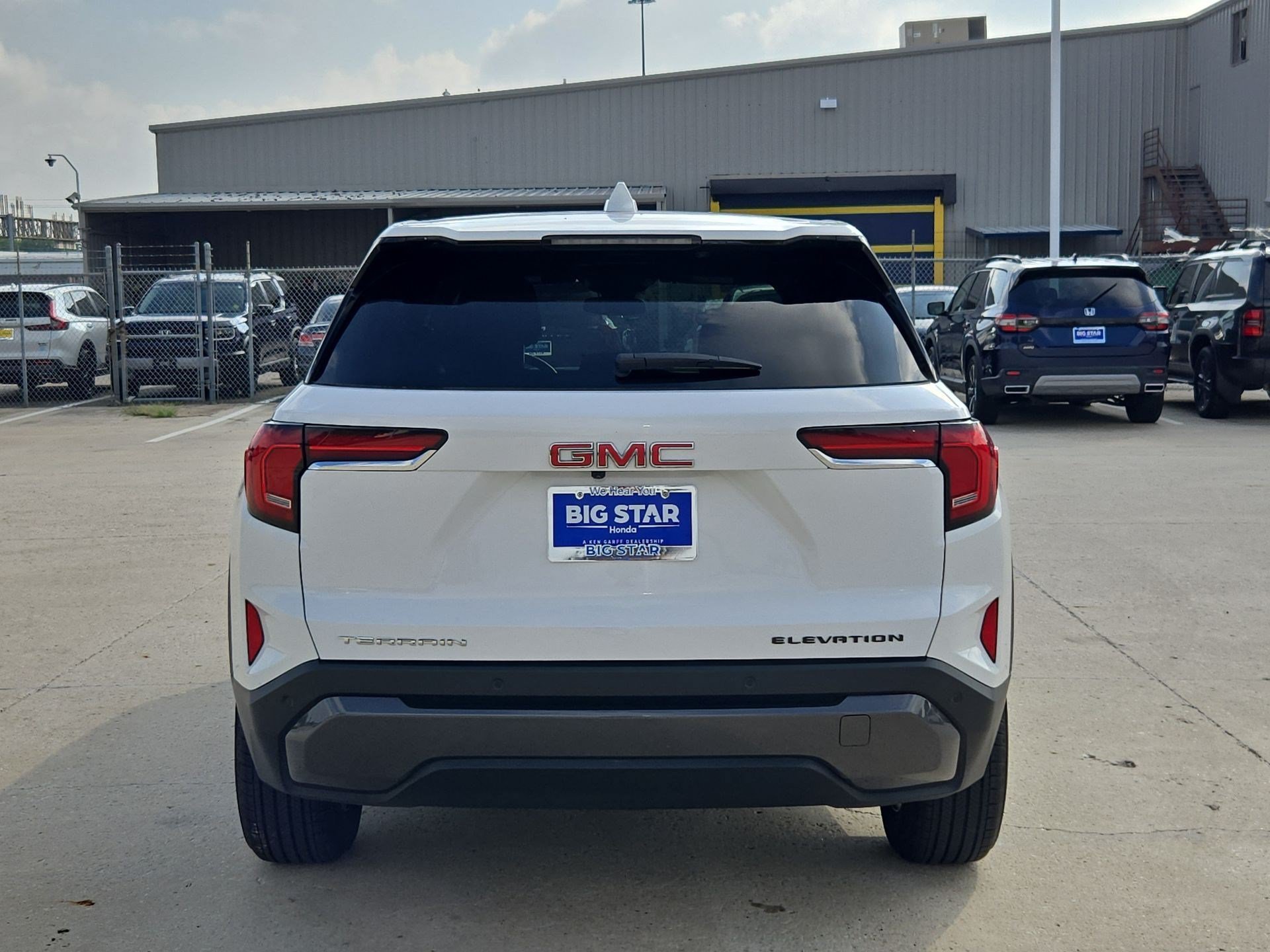 Used 2026 Summit White GMC FWD Elevation image 4