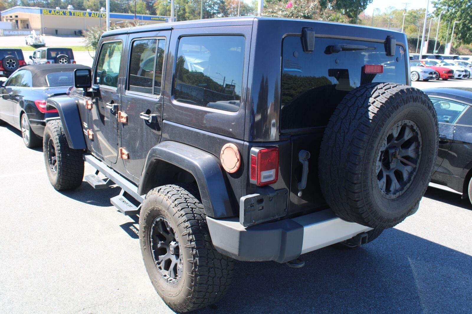 Used 2013 Rugged Brown Pearl Jeep Sahara image 7