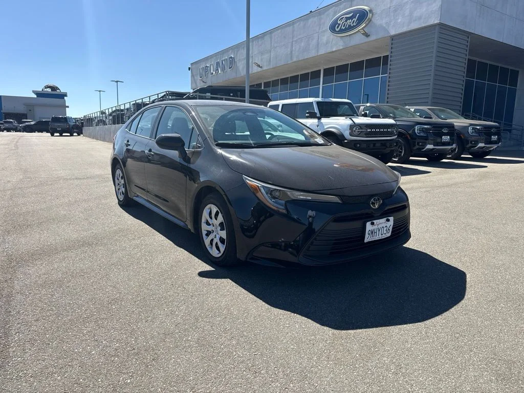 Used 2024 Midnight Black Metallic Toyota LE image 1