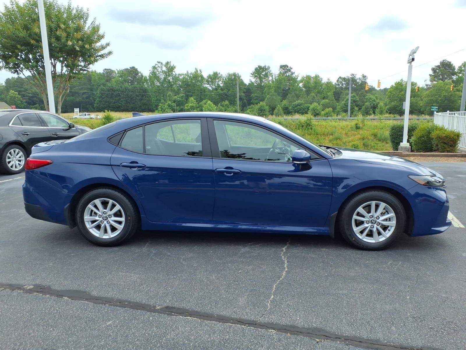 Used 2025 Reservoir Blue Toyota LE image 11