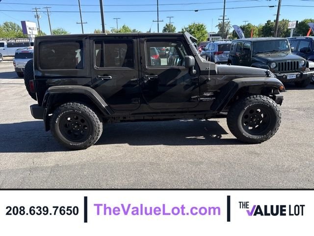Used 2011 Black Jeep Unlimited Sahara image 3