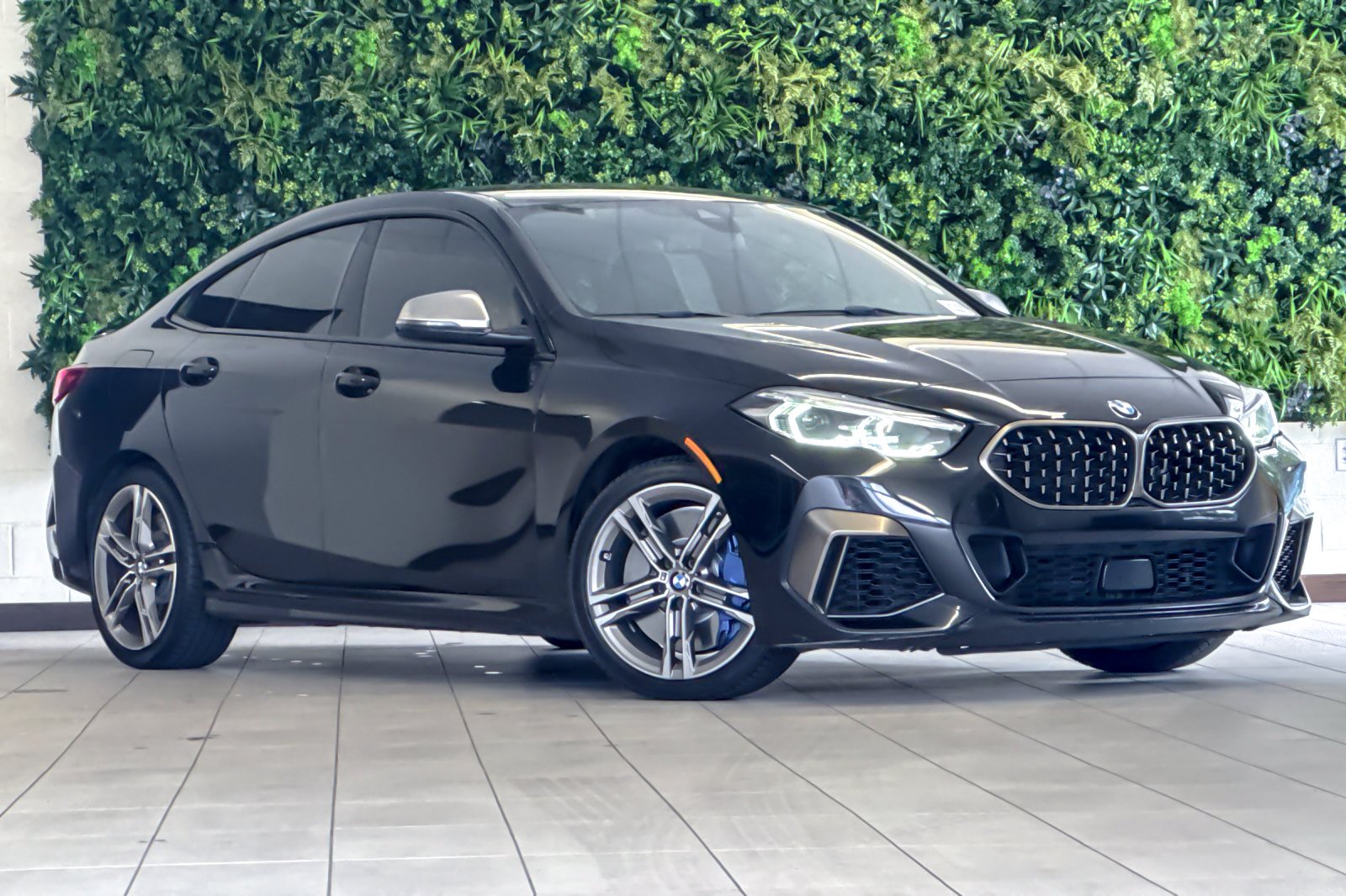 Used 2020 Black Sapphire Metallic BMW M235i xDrive image 1
