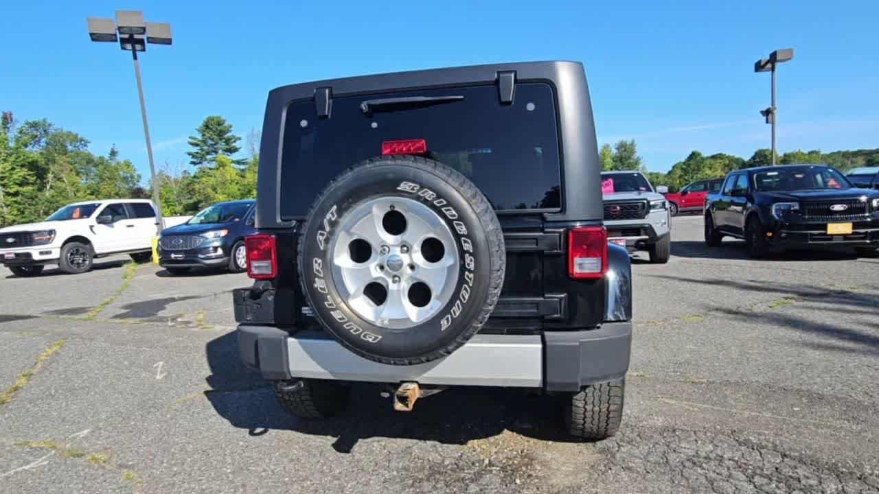 Used 2014 Black Clear Coat Jeep Sahara image 7